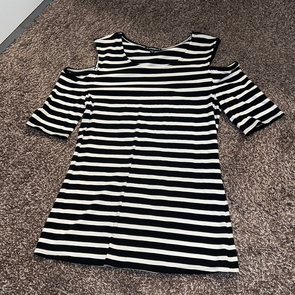 Express black and white striped tee  with cut out shoulders. Size M
